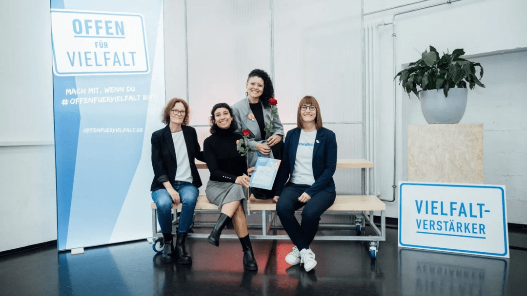 A PC screen with a picture of diverse women